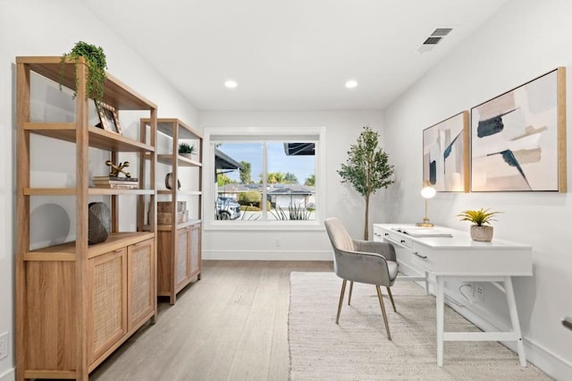 home office featuring light hardwood / wood-style flooring