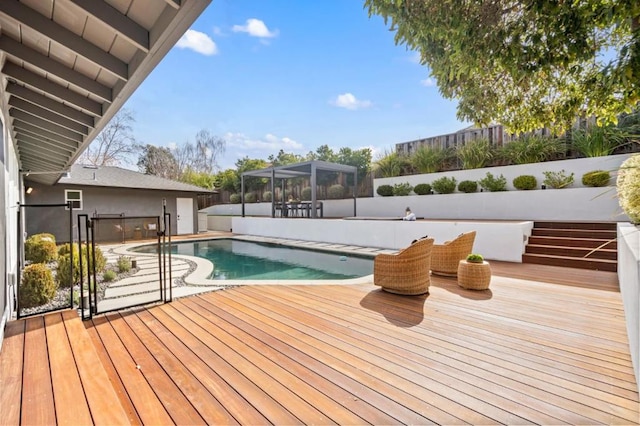 view of swimming pool with a deck