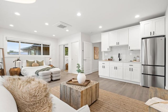 interior space featuring sink, plenty of natural light, and light wood-type flooring