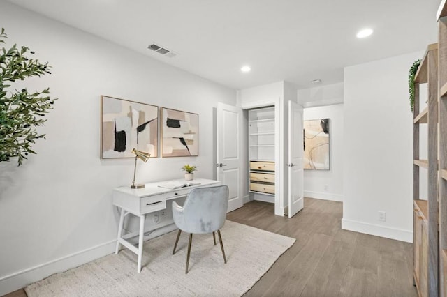 office with wood-type flooring