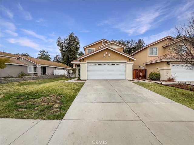 view of front of property with a garage and a front lawn