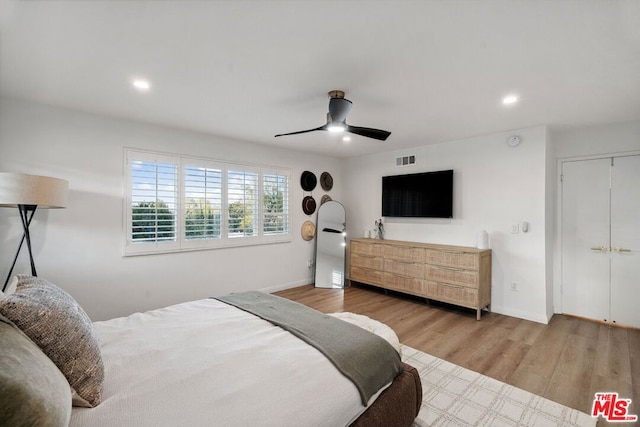 bedroom featuring hardwood / wood-style flooring and ceiling fan