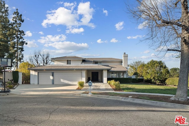 prairie-style home featuring a front lawn