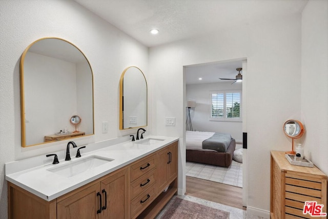 bathroom with vanity, wood-type flooring, and ceiling fan