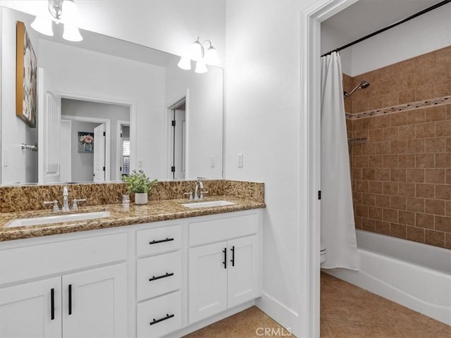 bathroom with tile patterned flooring, vanity, and shower / tub combo