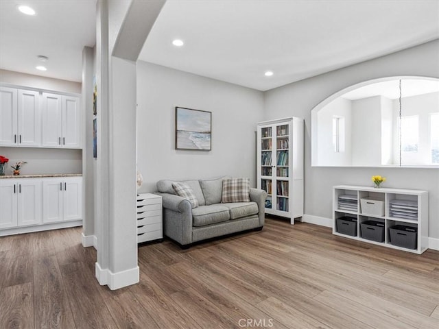 living room with light hardwood / wood-style flooring