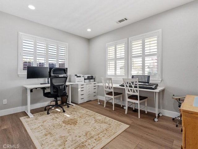 office with hardwood / wood-style flooring