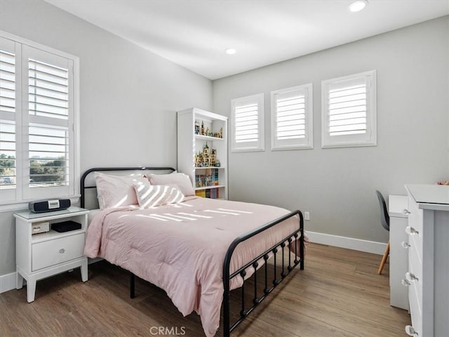 bedroom with light hardwood / wood-style flooring