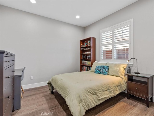 bedroom featuring hardwood / wood-style flooring