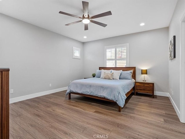 bedroom featuring wood-type flooring and ceiling fan