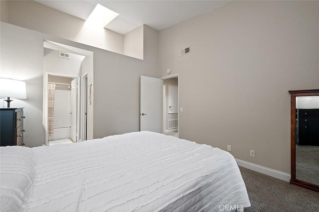 carpeted bedroom featuring high vaulted ceiling