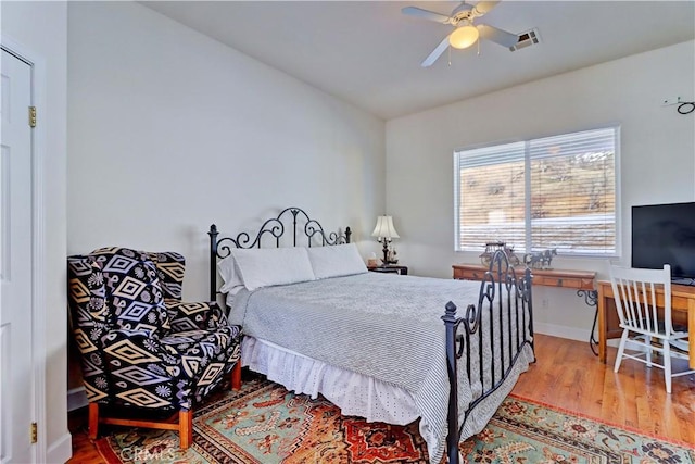 bedroom featuring hardwood / wood-style floors and ceiling fan