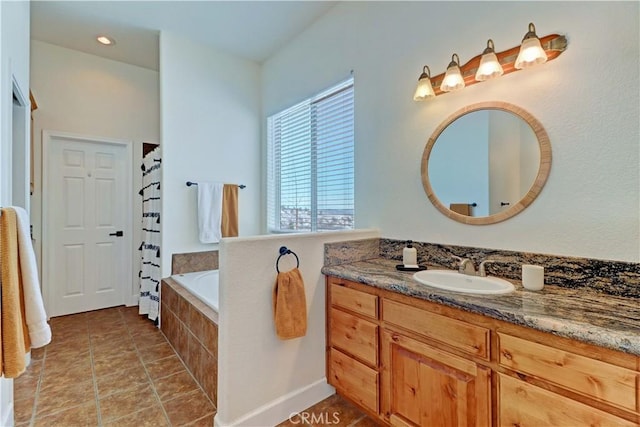 bathroom with vanity, tile patterned flooring, and separate shower and tub