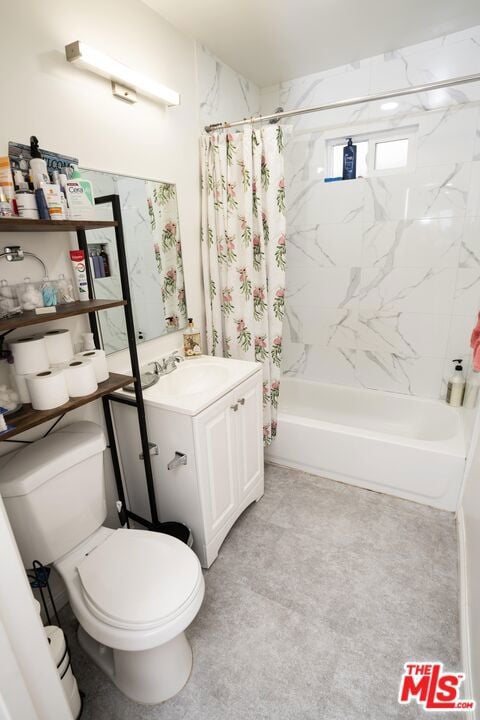 full bathroom featuring vanity, toilet, and shower / bath combo with shower curtain