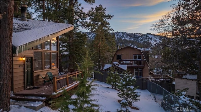 snow covered property with a mountain view