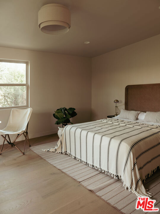 bedroom featuring light wood-type flooring