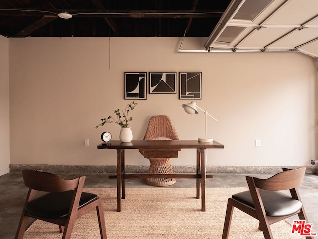 office area with concrete flooring