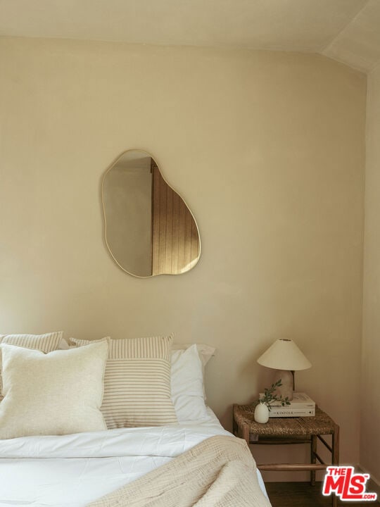 bedroom featuring vaulted ceiling