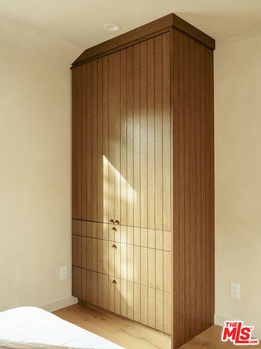 unfurnished bedroom with lofted ceiling