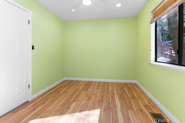 unfurnished room with light hardwood / wood-style flooring and ceiling fan