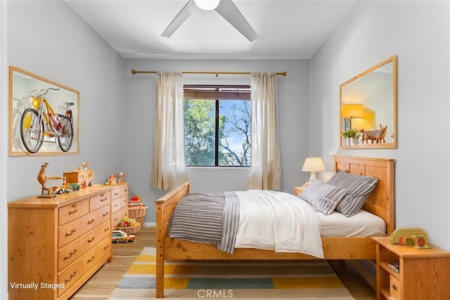 bedroom featuring ceiling fan and light wood-type flooring