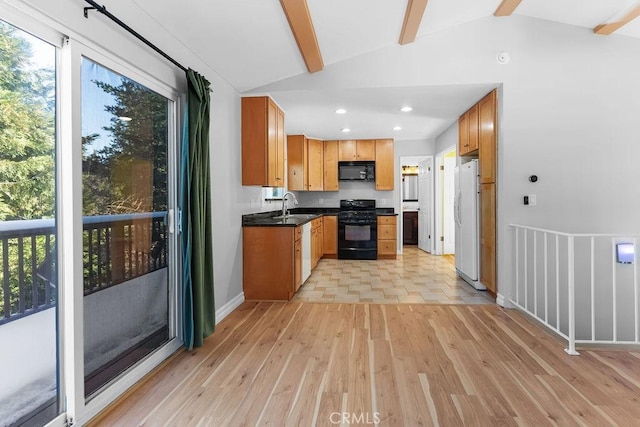 kitchen featuring light hardwood / wood-style flooring, sink, lofted ceiling with beams, and black appliances