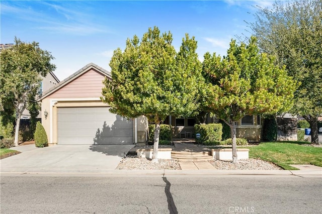 obstructed view of property featuring a garage