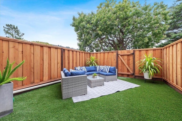 view of yard featuring a baseboard radiator, outdoor lounge area, and a patio area