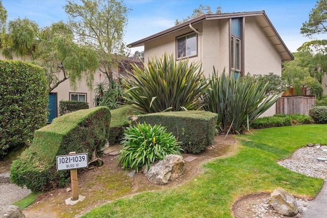 view of side of property with a yard