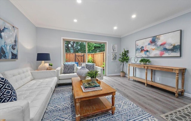 living room featuring crown molding and wood-type flooring