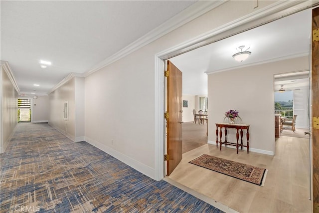 corridor featuring hardwood / wood-style floors and ornamental molding