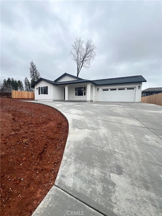 ranch-style home featuring a garage