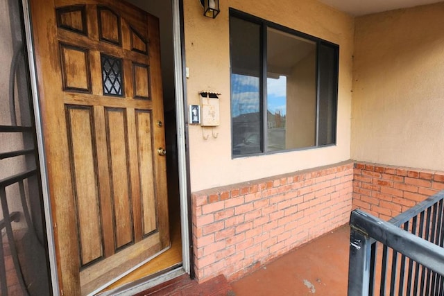 property entrance with a balcony