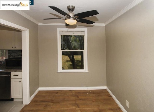 spare room with ornamental molding, dark wood-type flooring, and ceiling fan