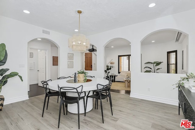 dining area with light hardwood / wood-style flooring