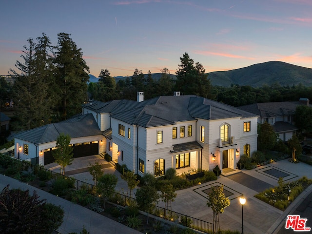 view of front of house with a garage and a mountain view