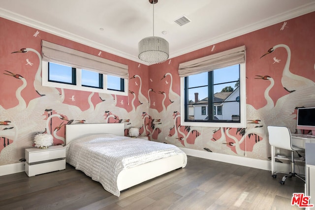 bedroom with crown molding and dark wood-type flooring