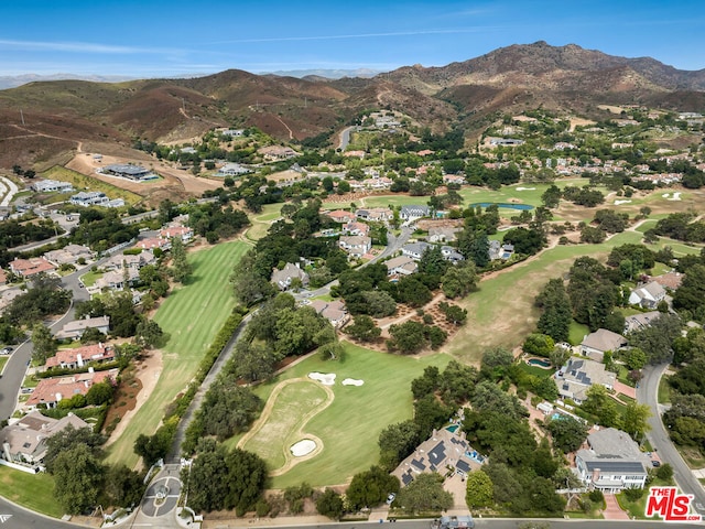 birds eye view of property featuring a mountain view