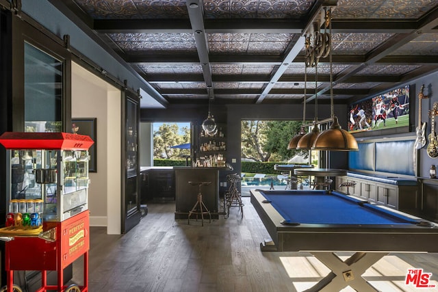 playroom with billiards, coffered ceiling, wood-type flooring, indoor bar, and a barn door