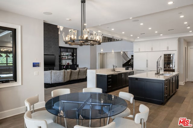 dining area with sink and dark wood-type flooring