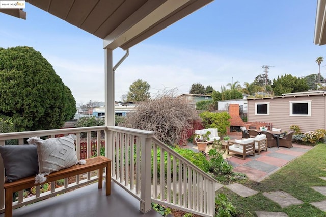 balcony featuring a fireplace and a patio