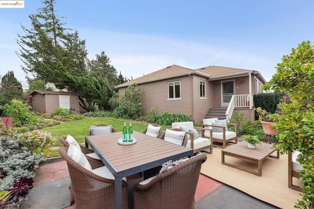 view of patio / terrace with outdoor lounge area and a storage unit