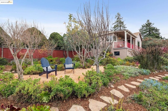 view of yard featuring a balcony