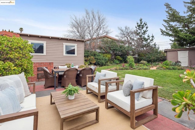 view of patio / terrace with an outdoor hangout area and a shed