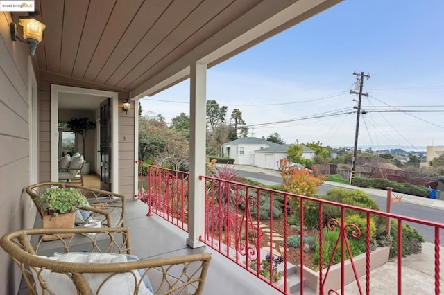 balcony featuring a porch