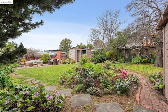 view of yard featuring a storage shed and an outdoor hangout area