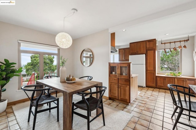 dining area with light tile patterned flooring