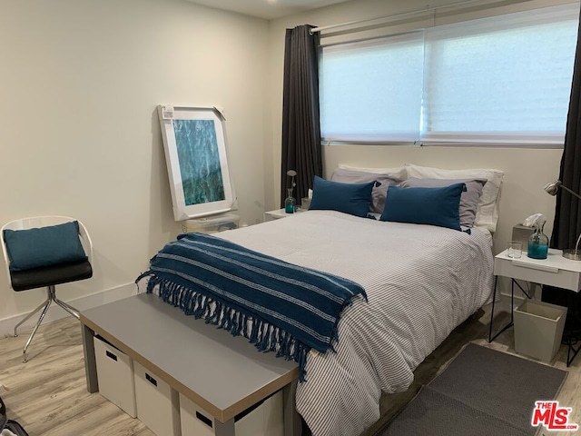 bedroom with light hardwood / wood-style flooring