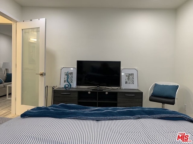 bedroom featuring wood-type flooring