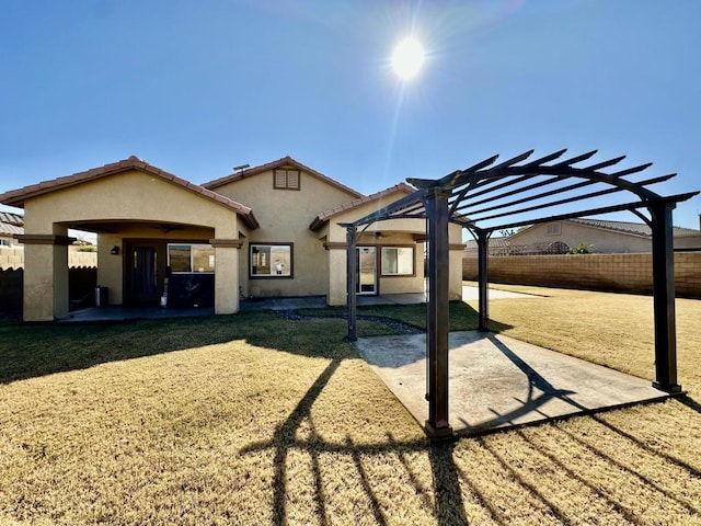 view of front of property with a pergola and a patio